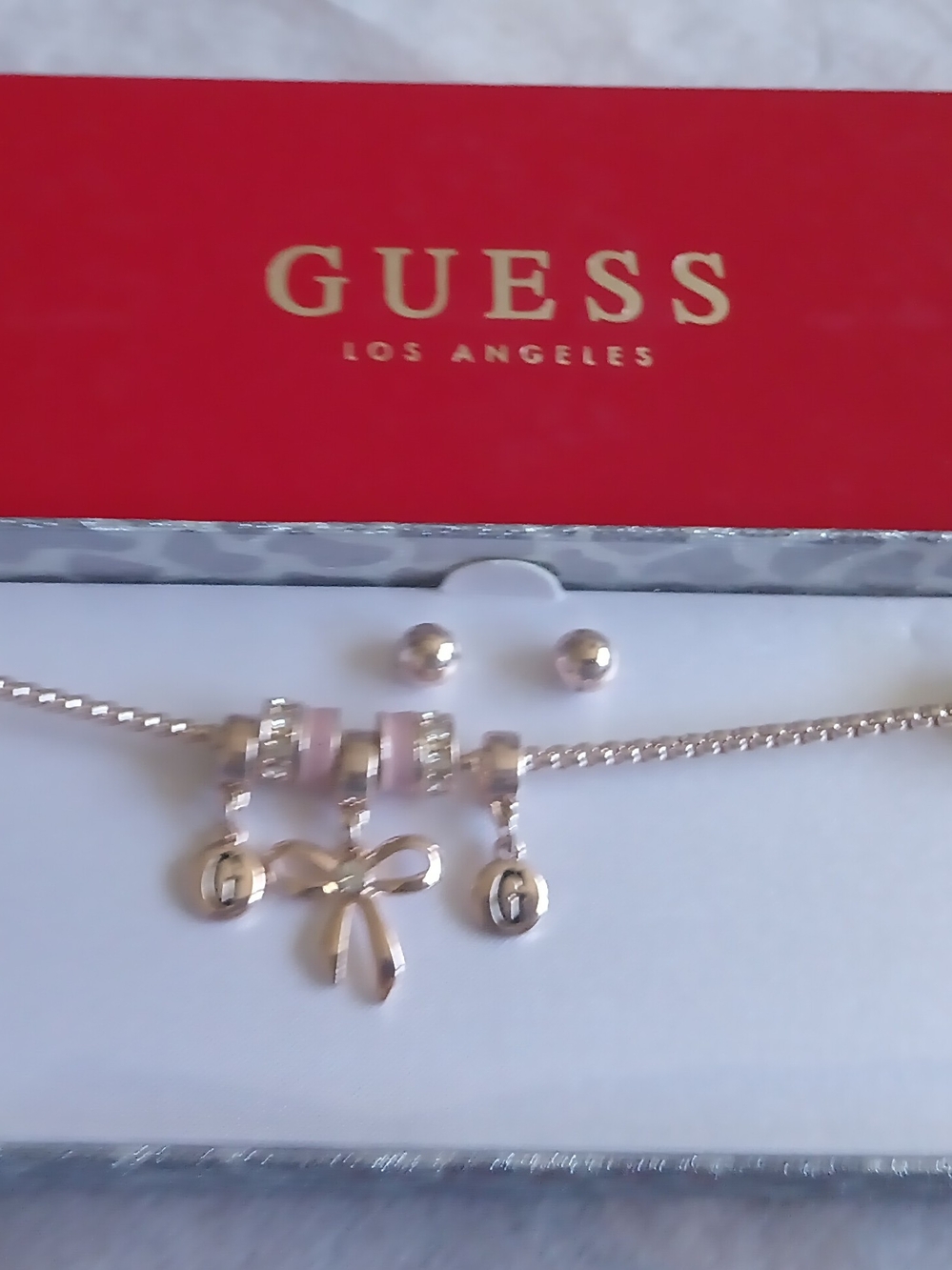 GUESS GOLD TONE CHARM BRACELET